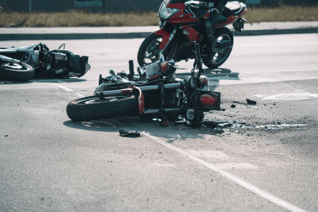 Tampa motorcycle accident attorney discussing helmet law claim with injured rider in office consultation